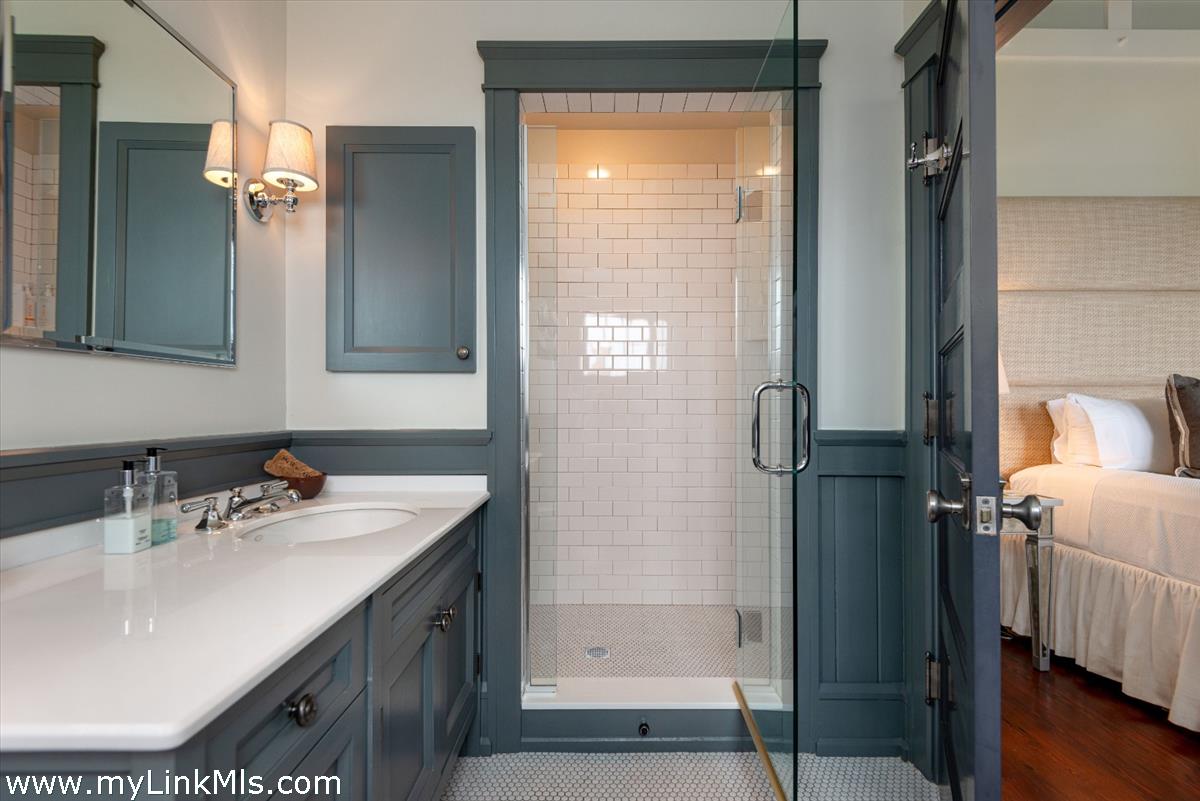 37 Sankaty Head Road Nantucket, MA 02554 - Photo 63 of 65 a bathroom with a sink a mirror and a shower