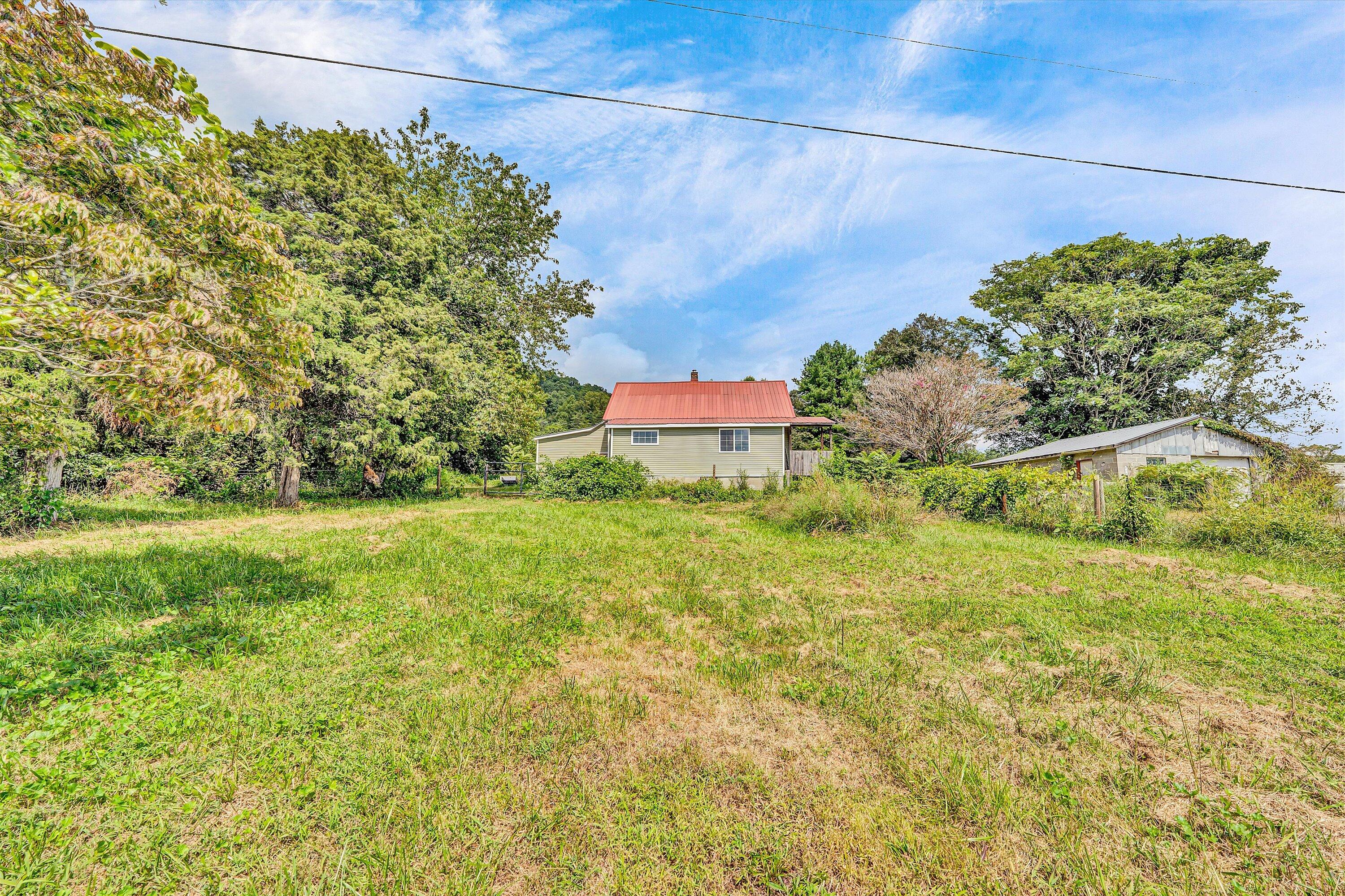 855 Algoma Road Callaway, VA 24067 - Photo 2 of 25 a view of a big yard with potted plants