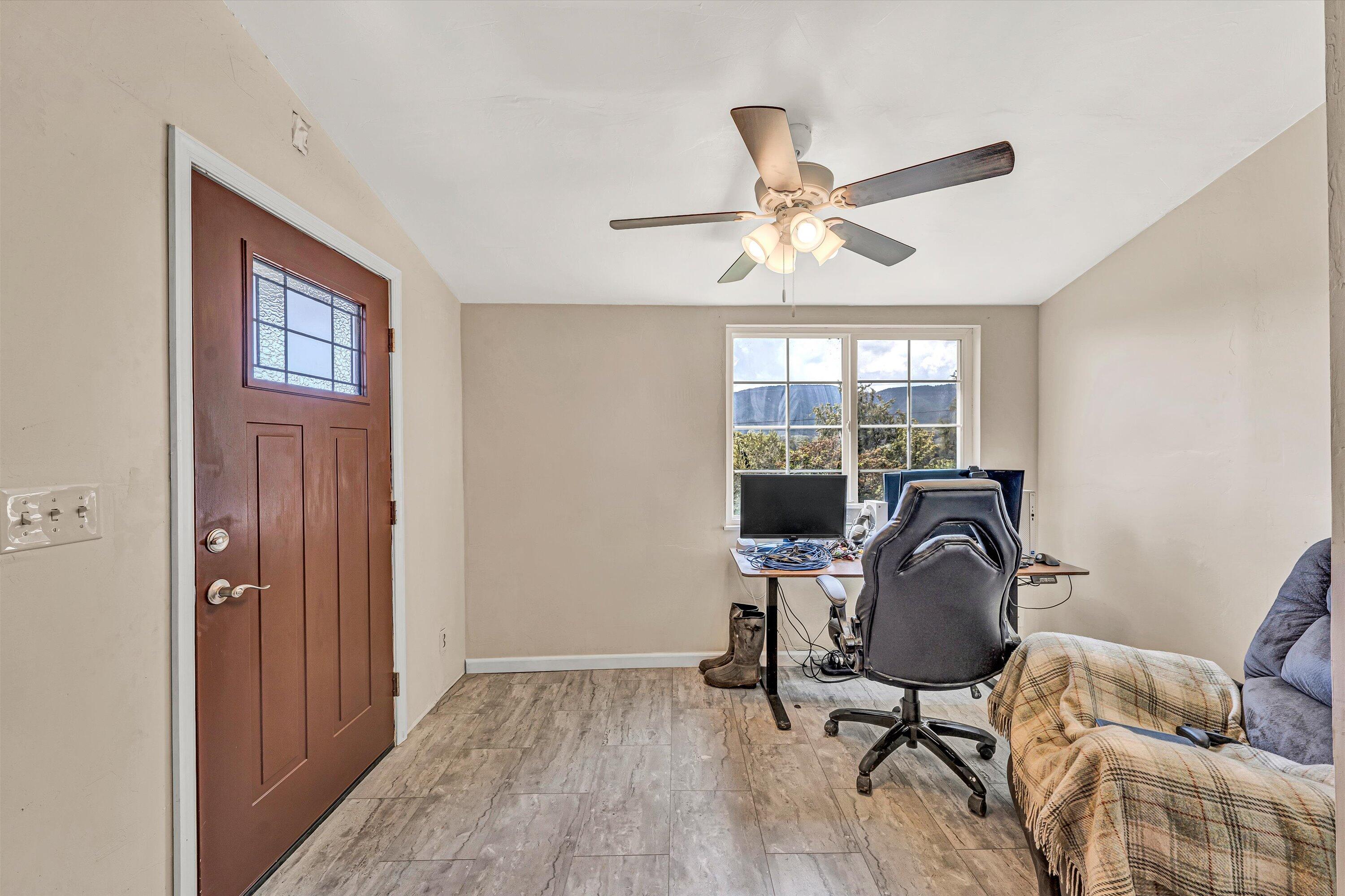 855 Algoma Road Callaway, VA 24067 - Photo 7 of 25 a workspace with furniture window and wooden floor