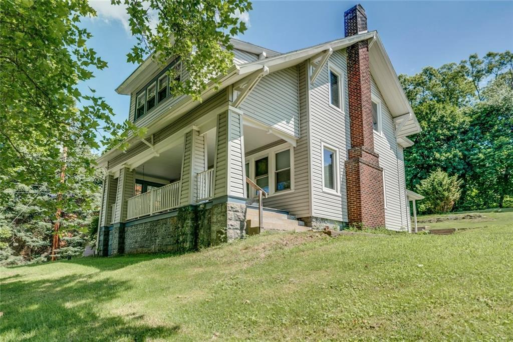 176 Churchill Road Turtle Creek, PA 15145 - Photo 2 of 25 Front of the house and side.