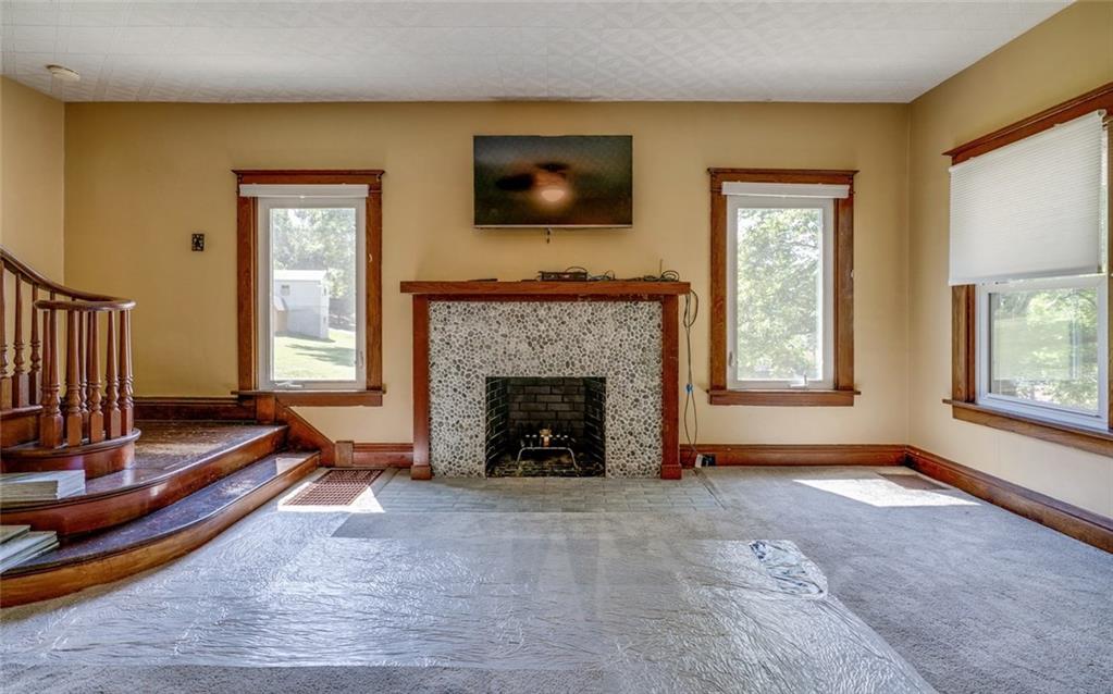 176 Churchill Road Turtle Creek, PA 15145 - Photo 11 of 25 Living room with fire place and its original mantle.