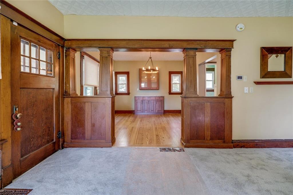 176 Churchill Road Turtle Creek, PA 15145 - Photo 13 of 25 View of the formal dining room from living room. Front door.