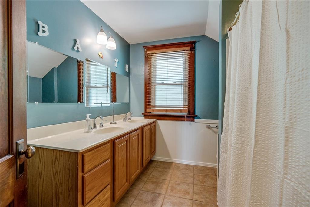 176 Churchill Road Turtle Creek, PA 15145 - Photo 19 of 25 Second floor full bath with double-sink vanity.