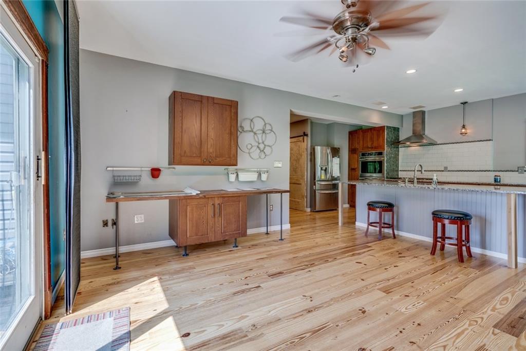 176 Churchill Road Turtle Creek, PA 15145 - Photo 3 of 25 Newly remodeled kitchen and family room-open floor plan and new hardwood floor.