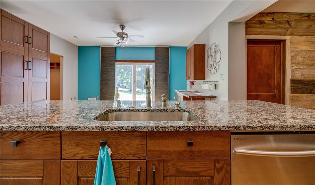 176 Churchill Road Turtle Creek, PA 15145 - Photo 6 of 25 Kitchen with view of the side patio and side yard through sliding door.