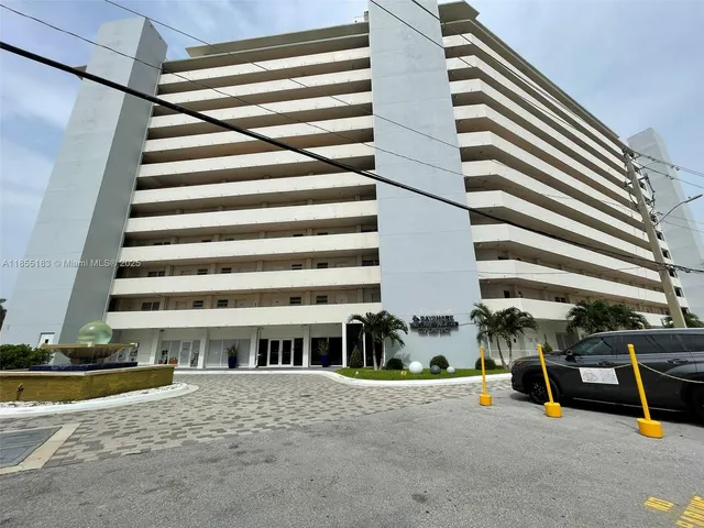 a front view of a house with porch and seating space