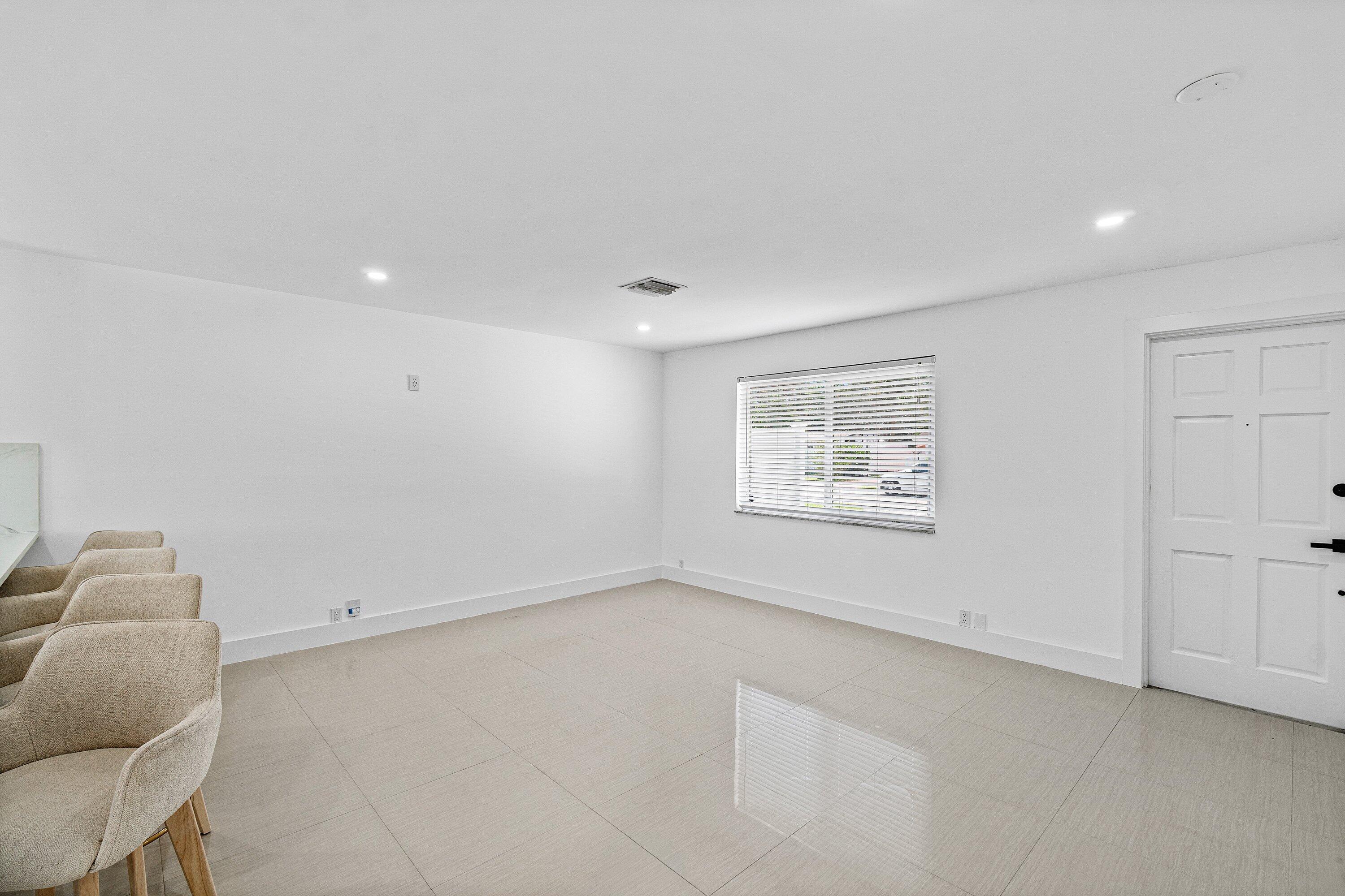 1531 Northwest 4th Street Boca Raton, FL 33486 - Photo 4 of 34 an empty room with a window