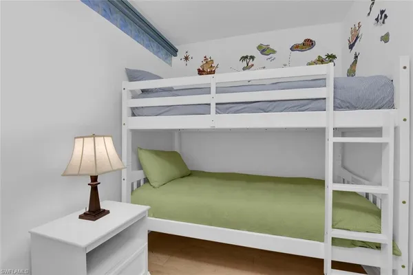 a living room with a bed and a table