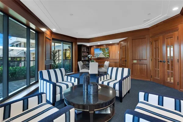 a view of a dining room with furniture window and outside view