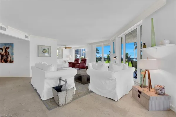 a living room with furniture and a table