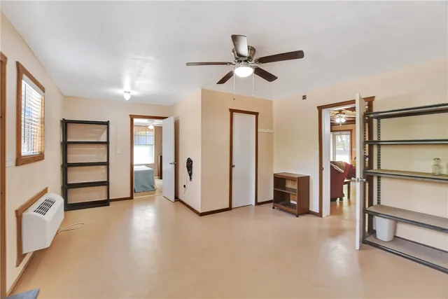 a view of a livingroom with furniture and a window