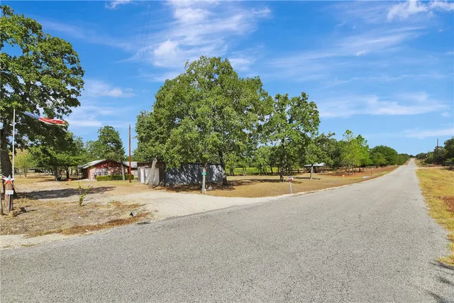 a view of a road with a building in the background