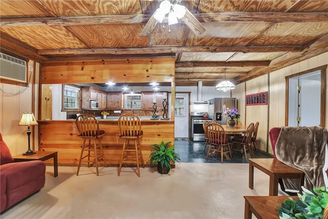 a dining room with furniture and a chandelier