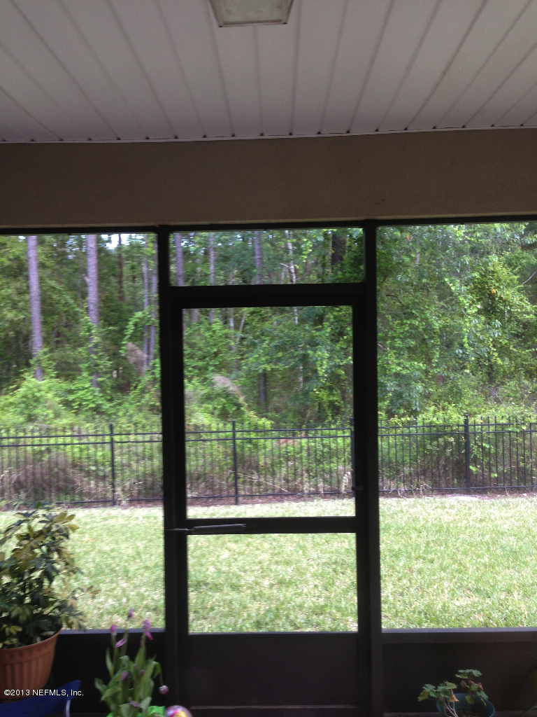 12917 Spring Rain Road Jacksonville, FL 32258 - Photo 7 of 9 screened porch overlooking private area!