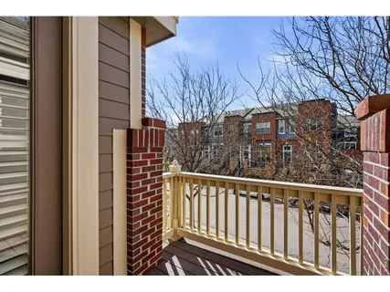 a view of wooden house with a deck
