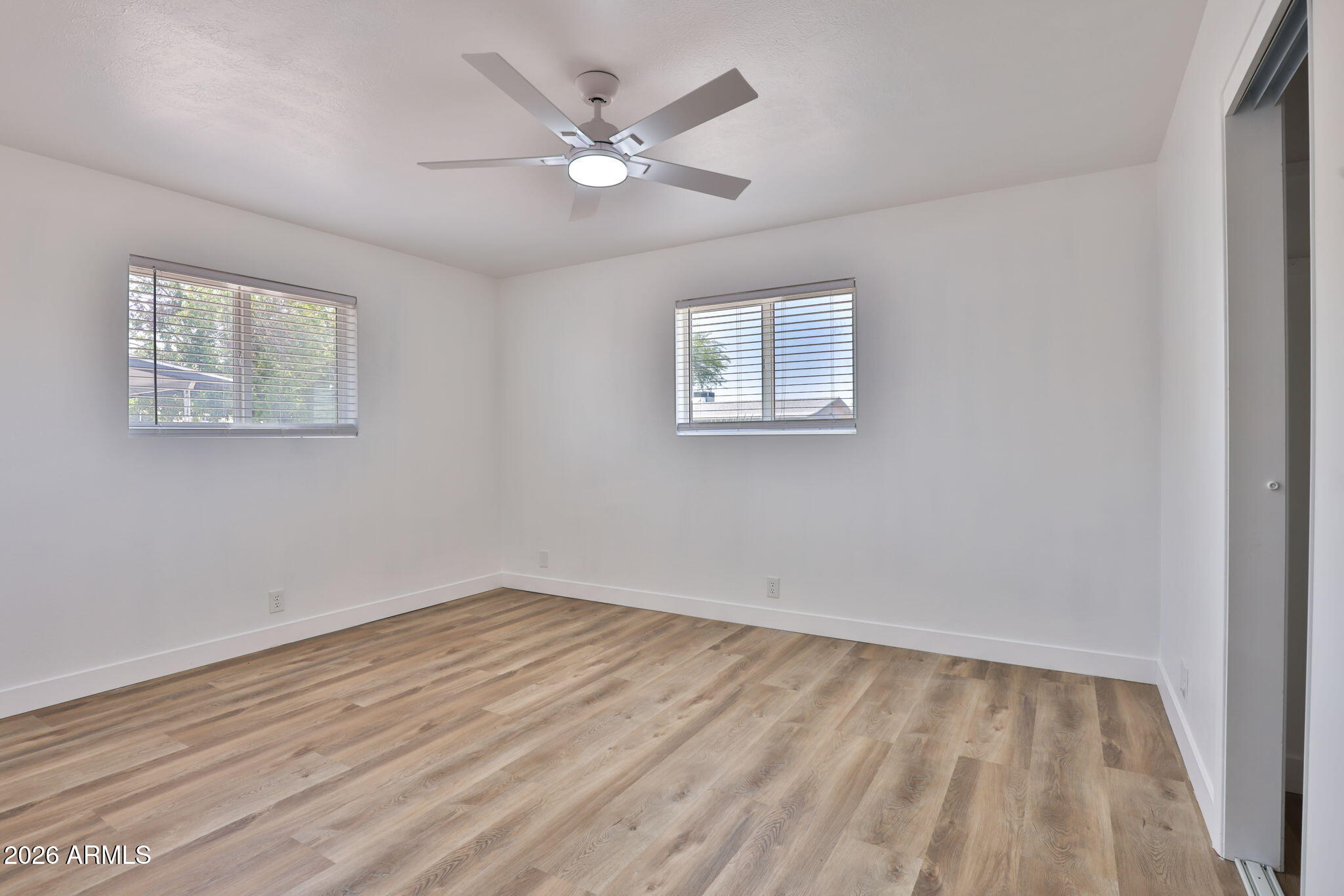 5510 East Dallas Street Mesa, AZ 85205 - Photo 13 of 24 a view of a room with wooden floor and window