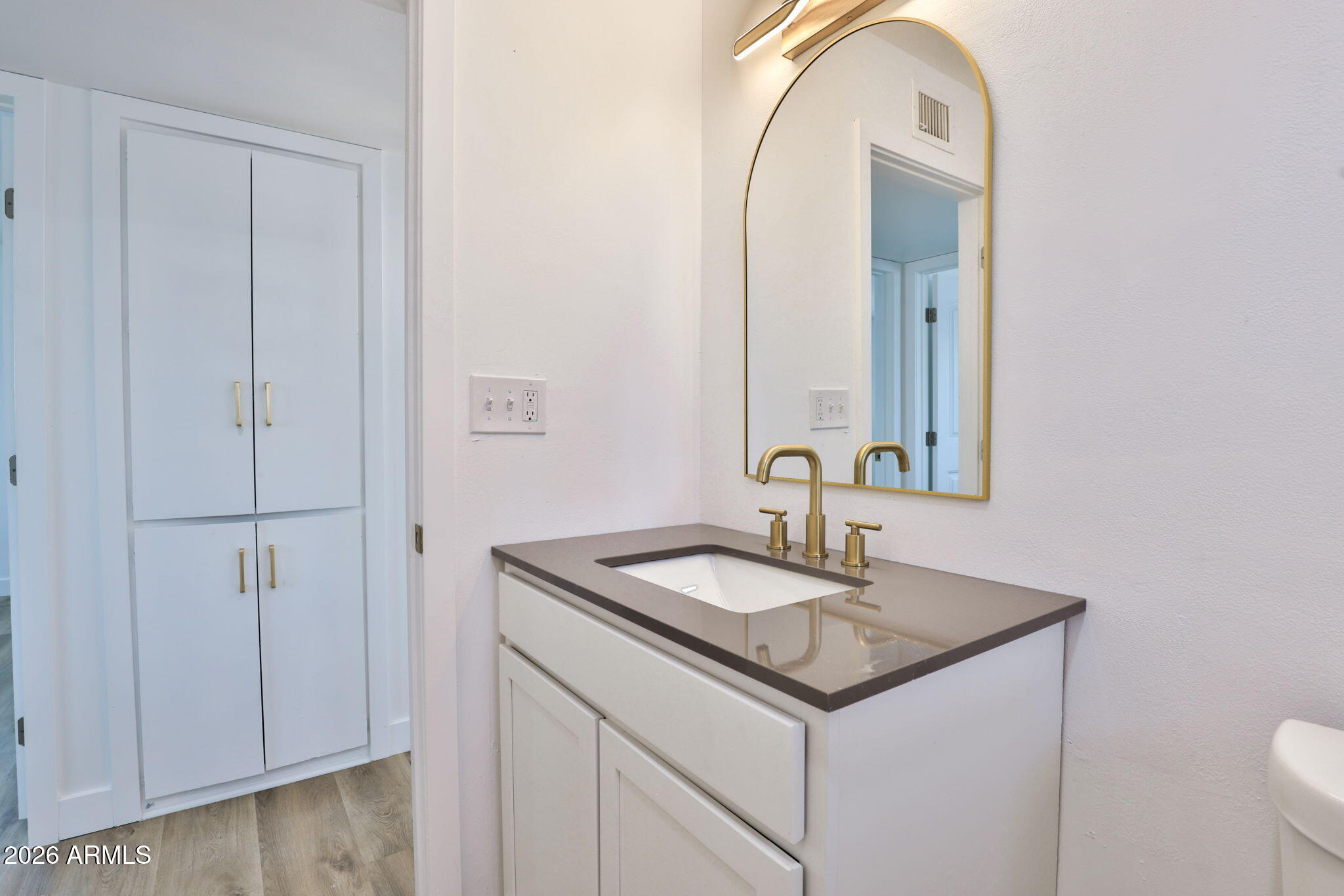 5510 East Dallas Street Mesa, AZ 85205 - Photo 16 of 24 a bathroom with a sink and a mirror