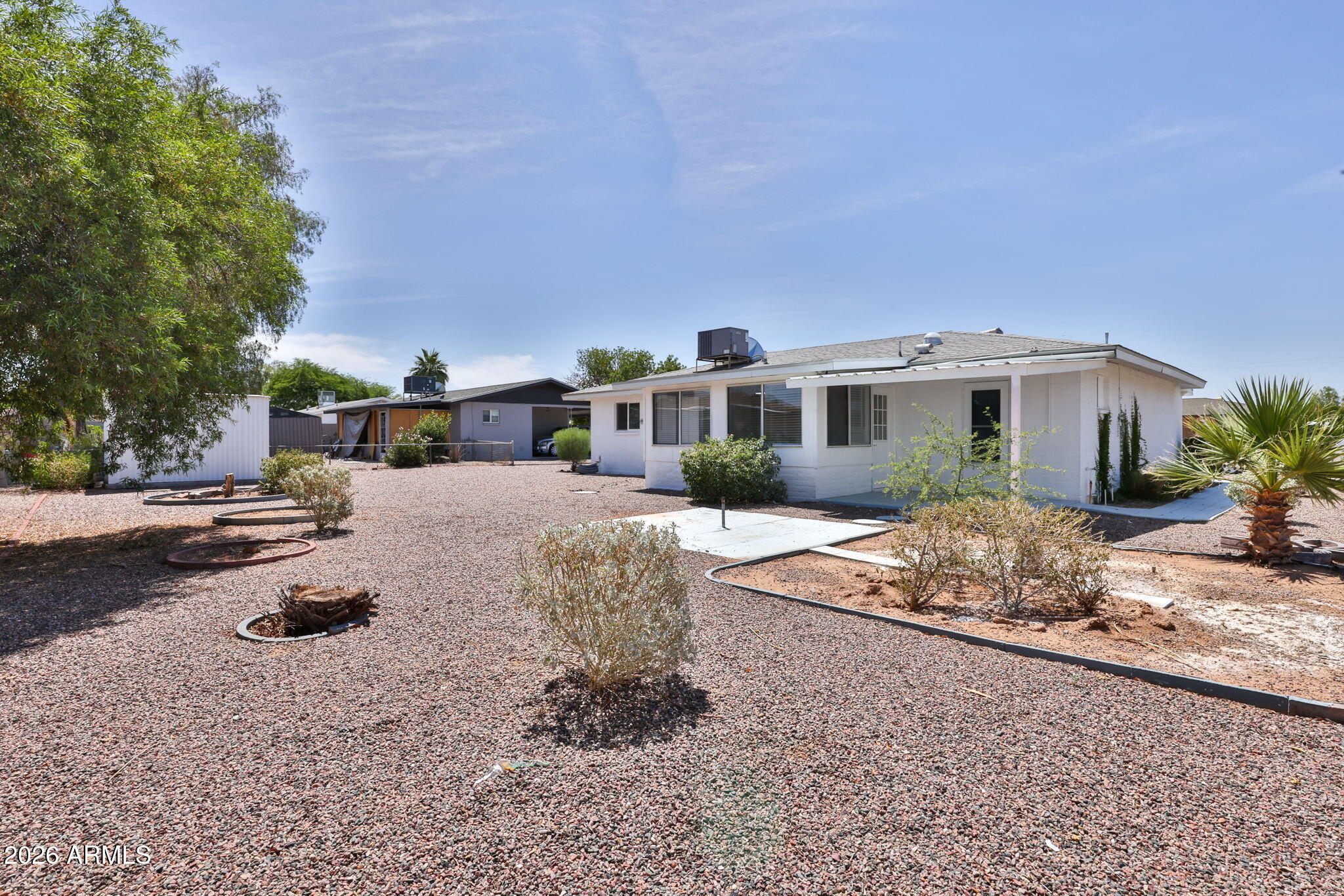 5510 East Dallas Street Mesa, AZ 85205 - Photo 22 of 24 a view of a house with backyard and sitting area