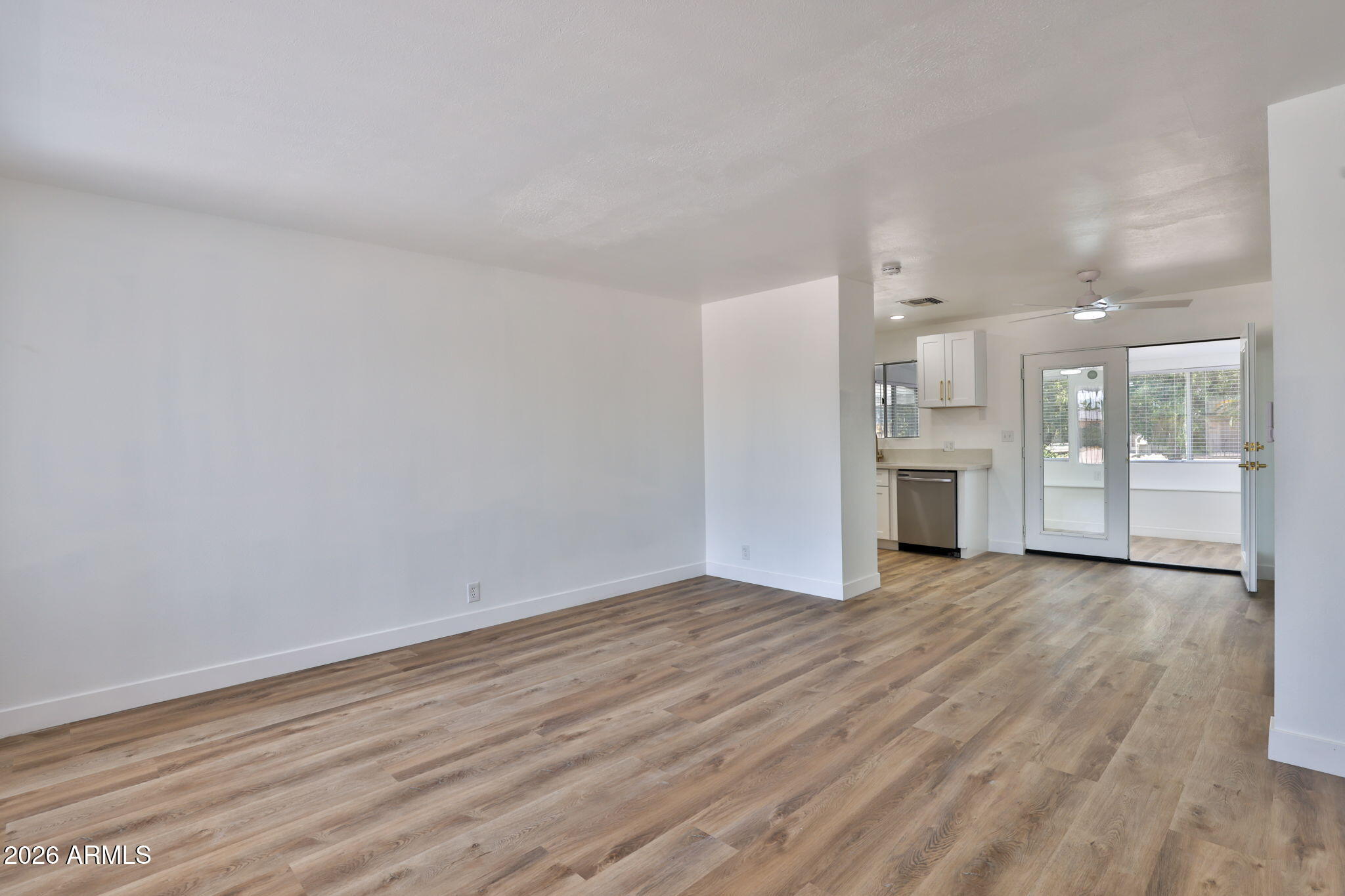 5510 East Dallas Street Mesa, AZ 85205 - Photo 3 of 24 a view of empty room with wooden floor