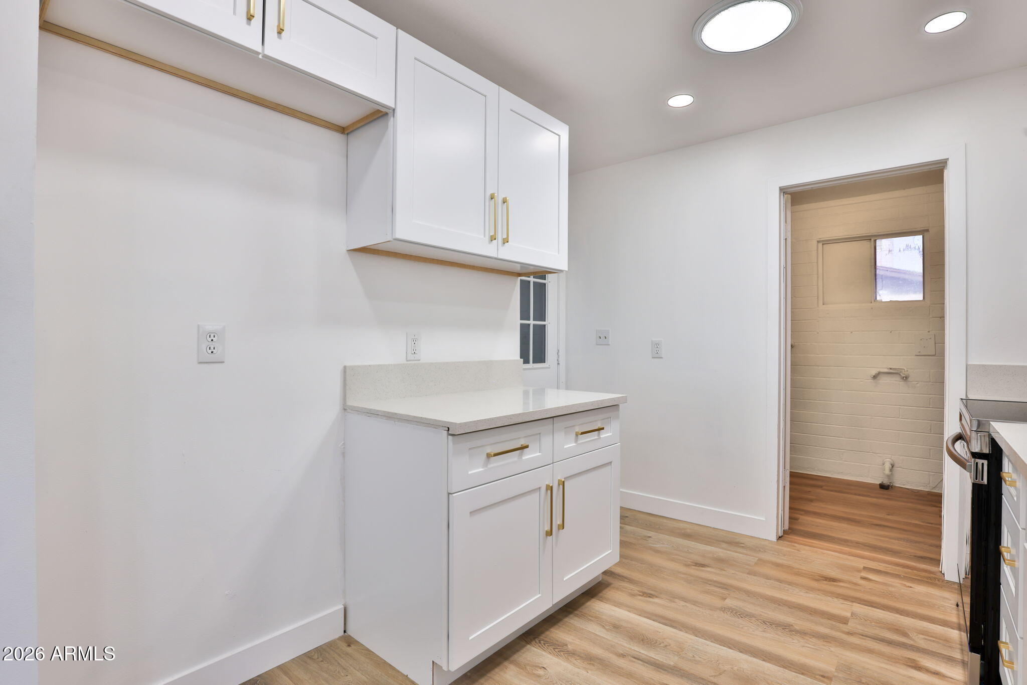 5510 East Dallas Street Mesa, AZ 85205 - Photo 8 of 24 a view of cabinets and wooden floor