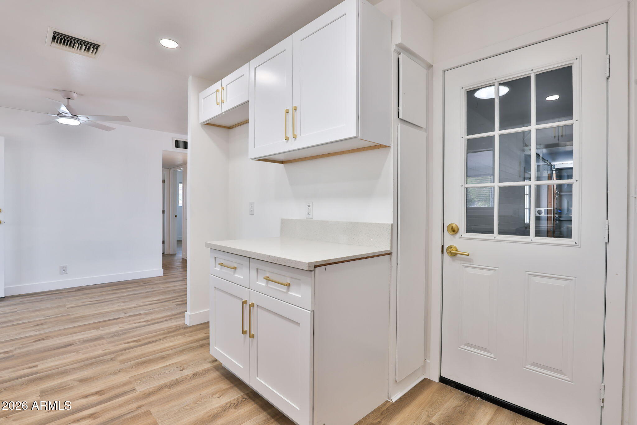 5510 East Dallas Street Mesa, AZ 85205 - Photo 10 of 24 a view of cabinets and wooden floor