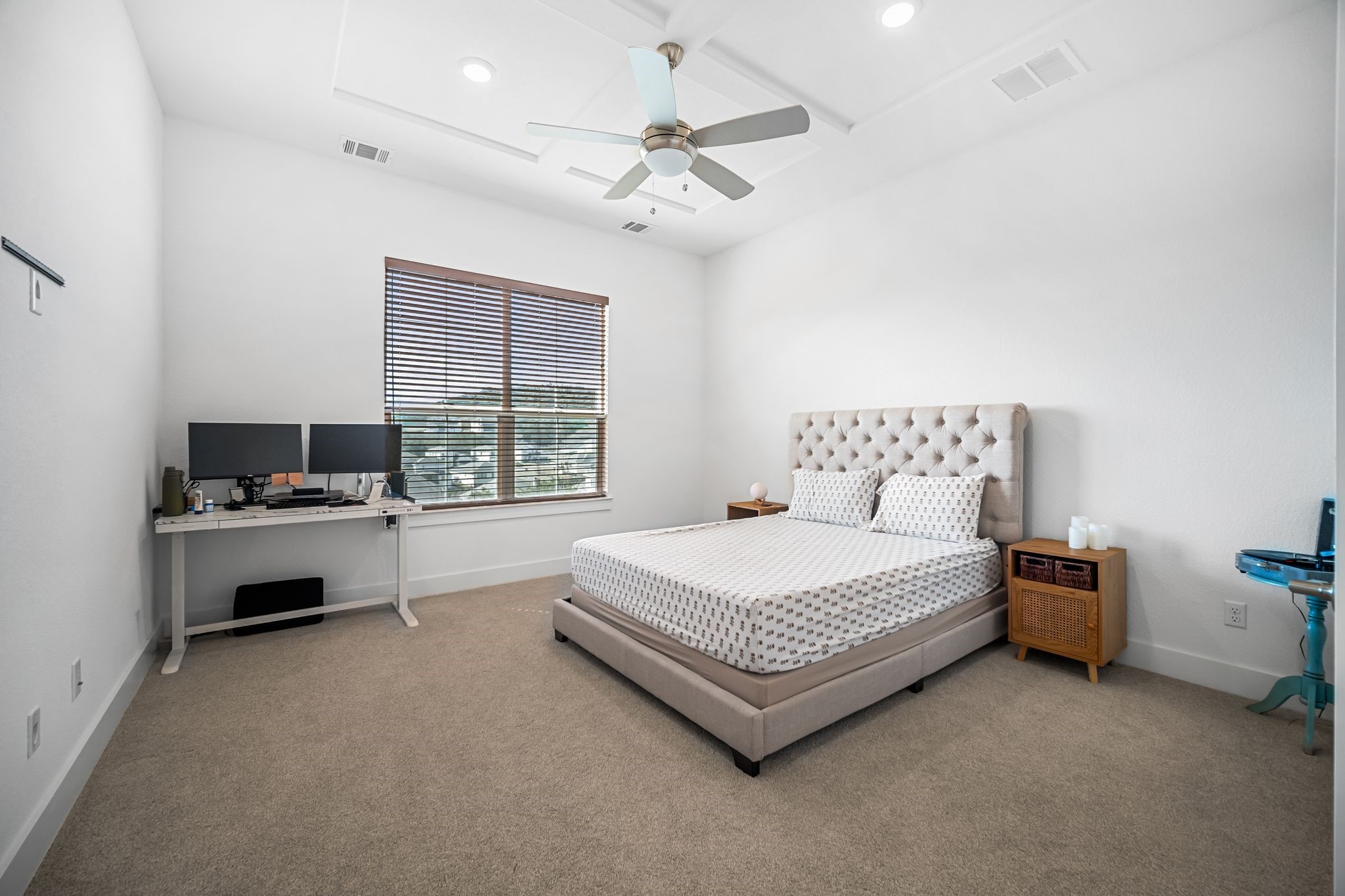 303 Cartwheel Bend Austin, TX 78738 - Photo 14 of 25 a spacious bedroom with a bed and a chandelier