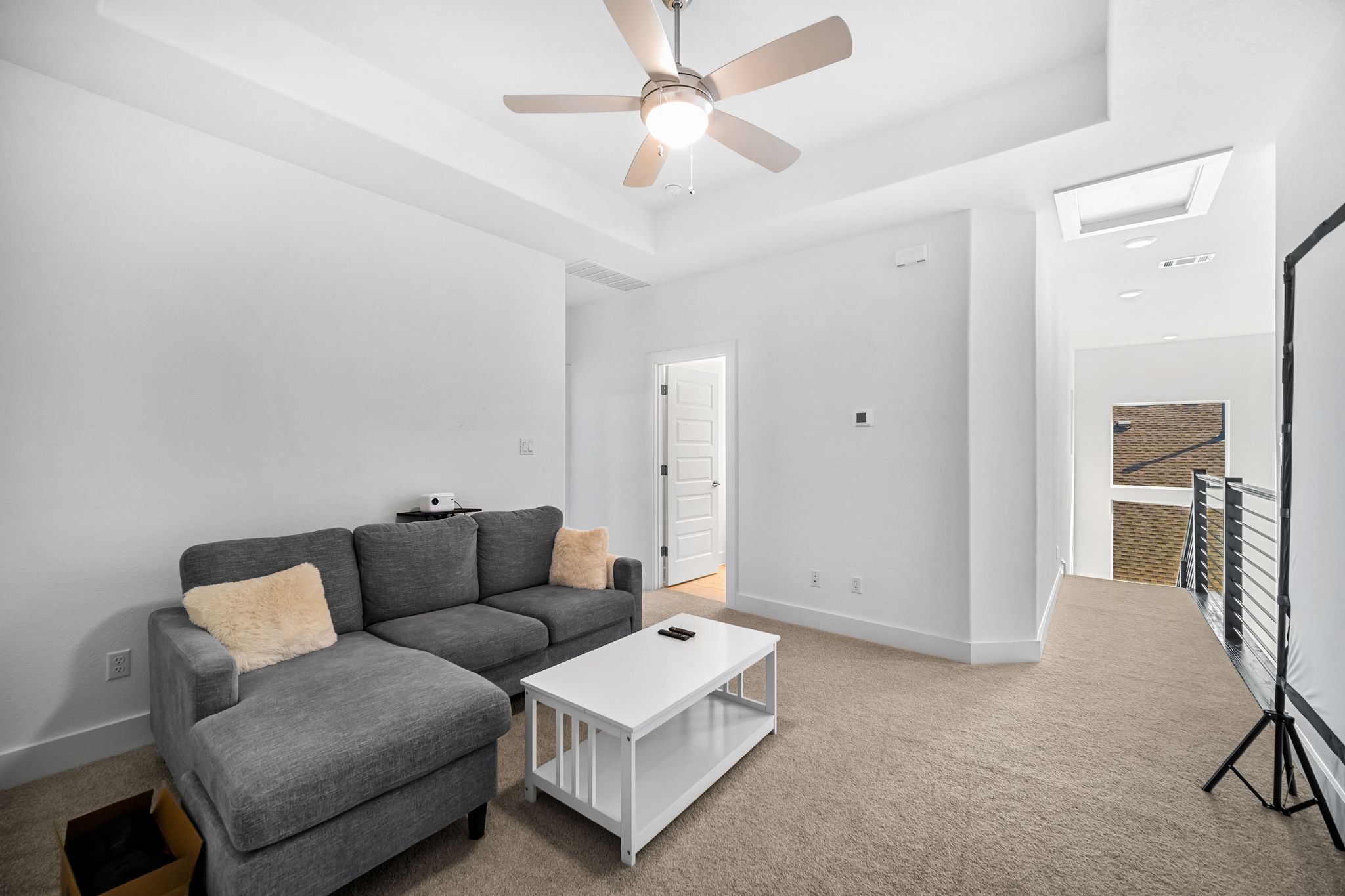 303 Cartwheel Bend Austin, TX 78738 - Photo 19 of 25 a living room with furniture and a ceiling fan