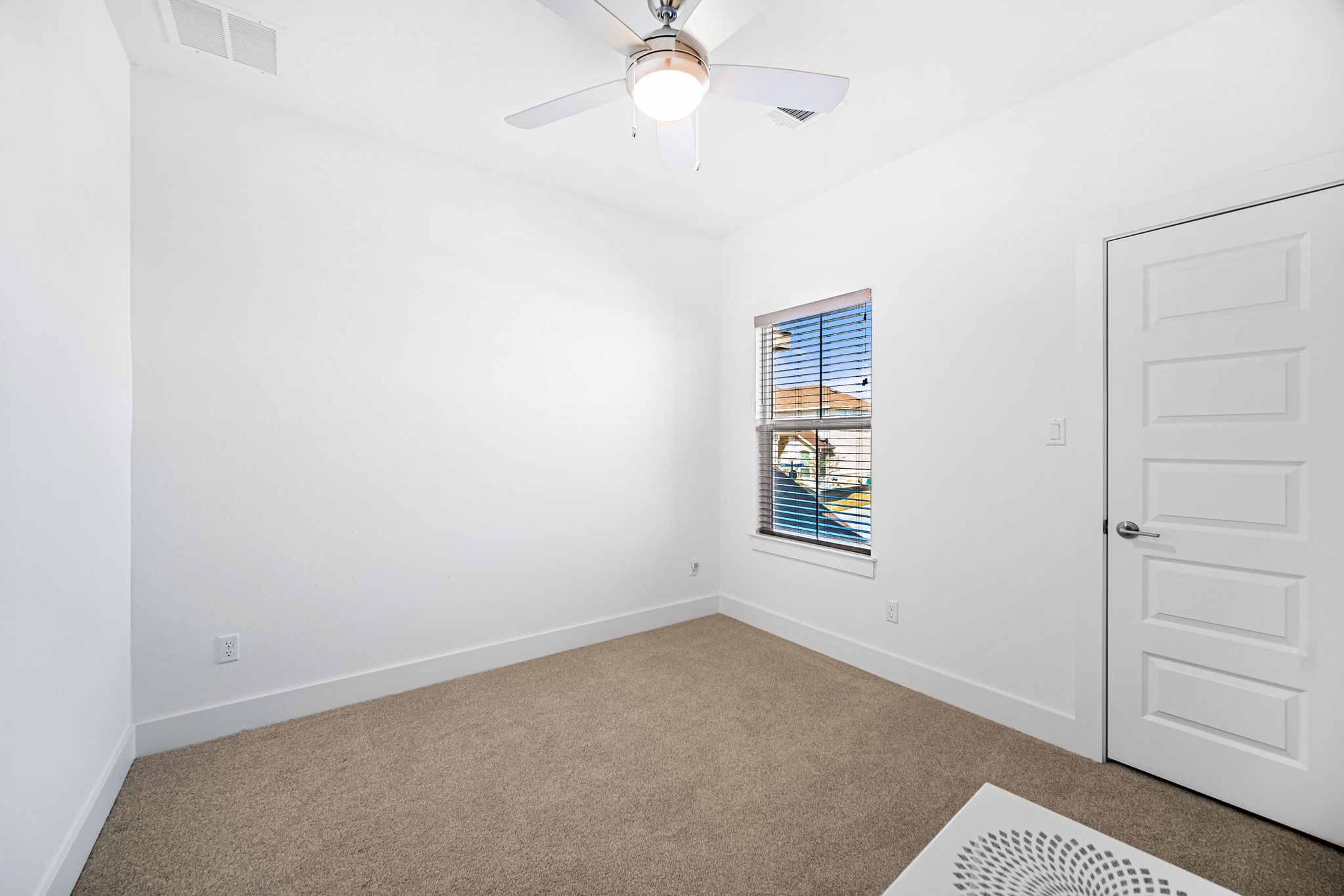 303 Cartwheel Bend Austin, TX 78738 - Photo 20 of 25 an empty room with closet and windows