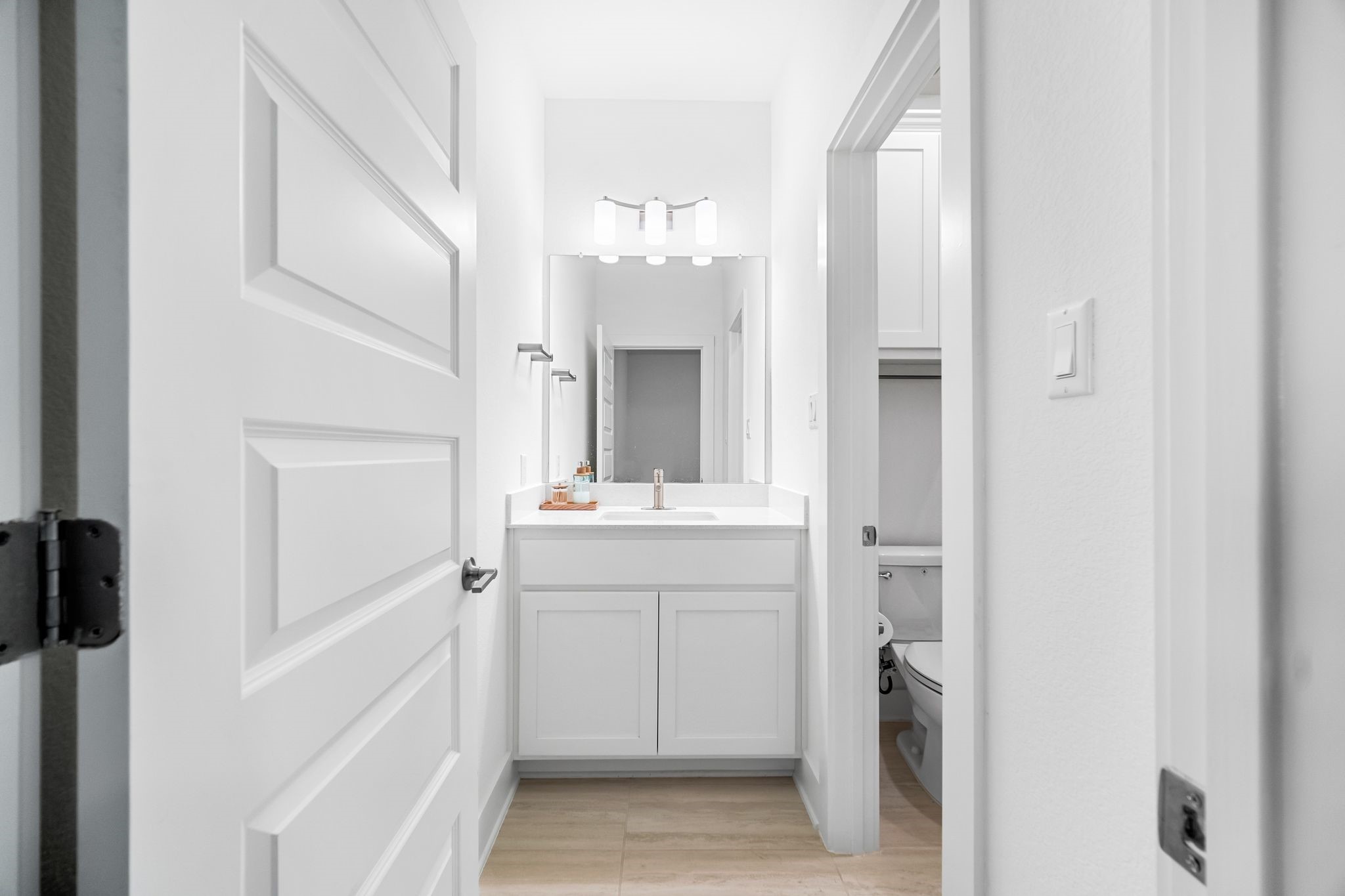303 Cartwheel Bend Austin, TX 78738 - Photo 22 of 25 a bathroom with a sink and a mirror