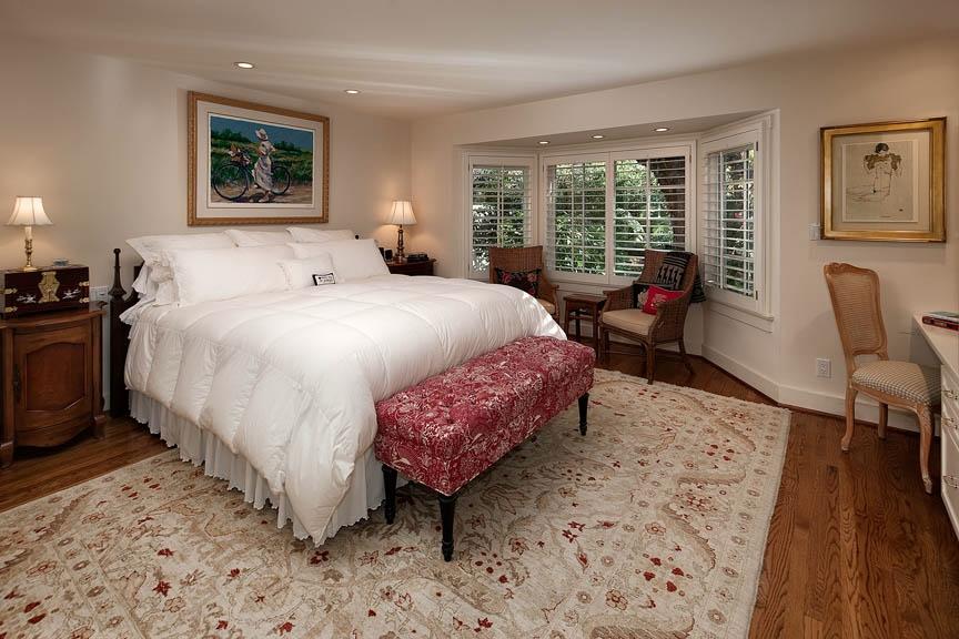 396 Hot Springs Road Montecito, CA 93108 - Photo 11 of 17 a bedroom with a bed large window with table and chair
