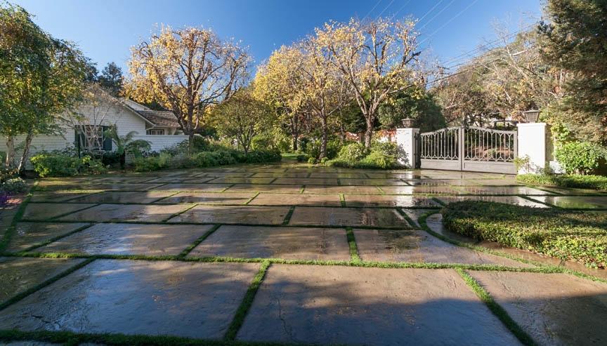 396 Hot Springs Road Montecito, CA 93108 - Photo 3 of 17 a view of a yard with cars parked on the road