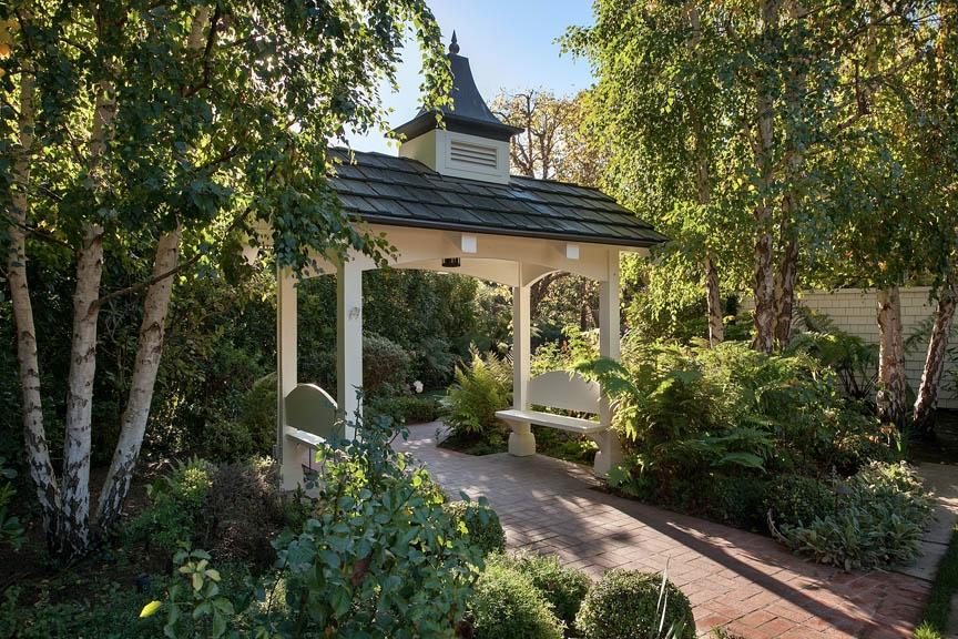 396 Hot Springs Road Montecito, CA 93108 - Photo 5 of 17 a view of a patio with table and chairs and potted plants