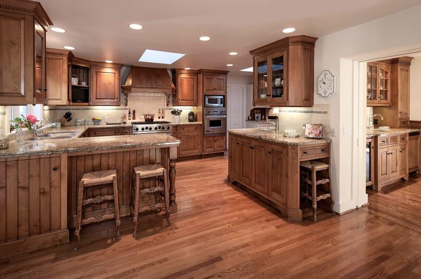 396 Hot Springs Road Montecito, CA 93108 - Photo 8 of 17 a kitchen with stainless steel appliances granite countertop wooden floors and wooden cabinets