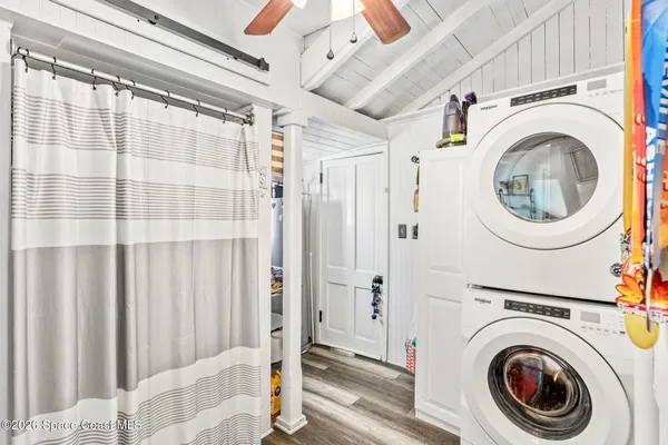 a view of a hallway with washer and dryer