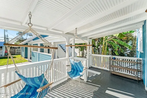 a view of a porch with furniture