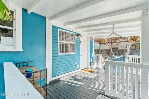 a view of balcony with furniture