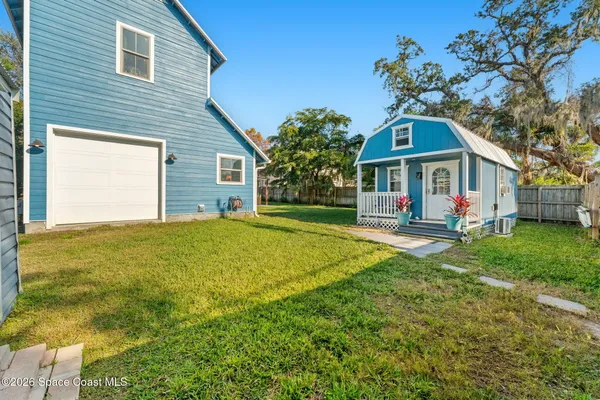 a view of a room with chair and front door