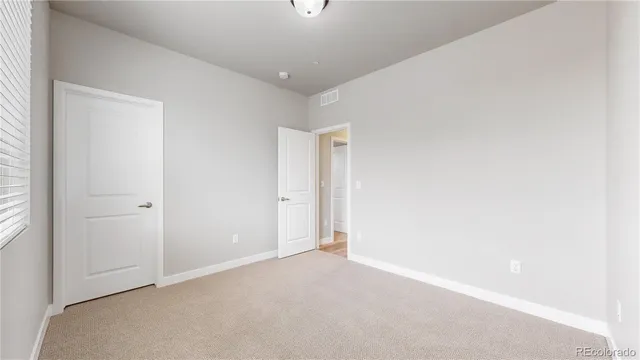 a view of a balcony with wooden floor