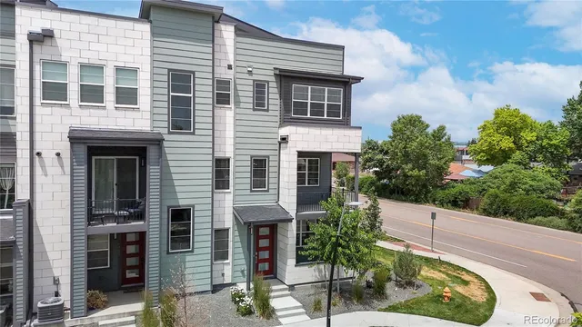 a view of a kitchen with a sink a refrigerator and a fireplace
