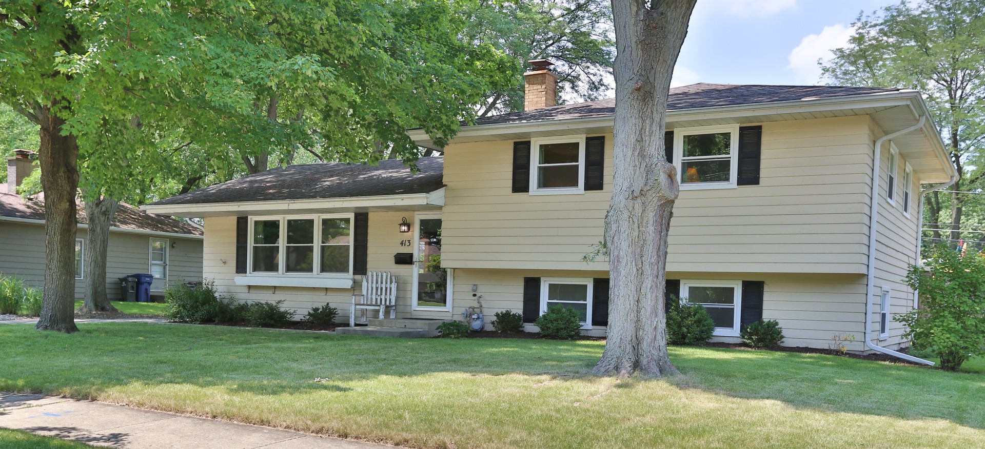 413 West Gartner Road Naperville, IL 60540 - Photo 2 of 22 a front view of a house with a garden