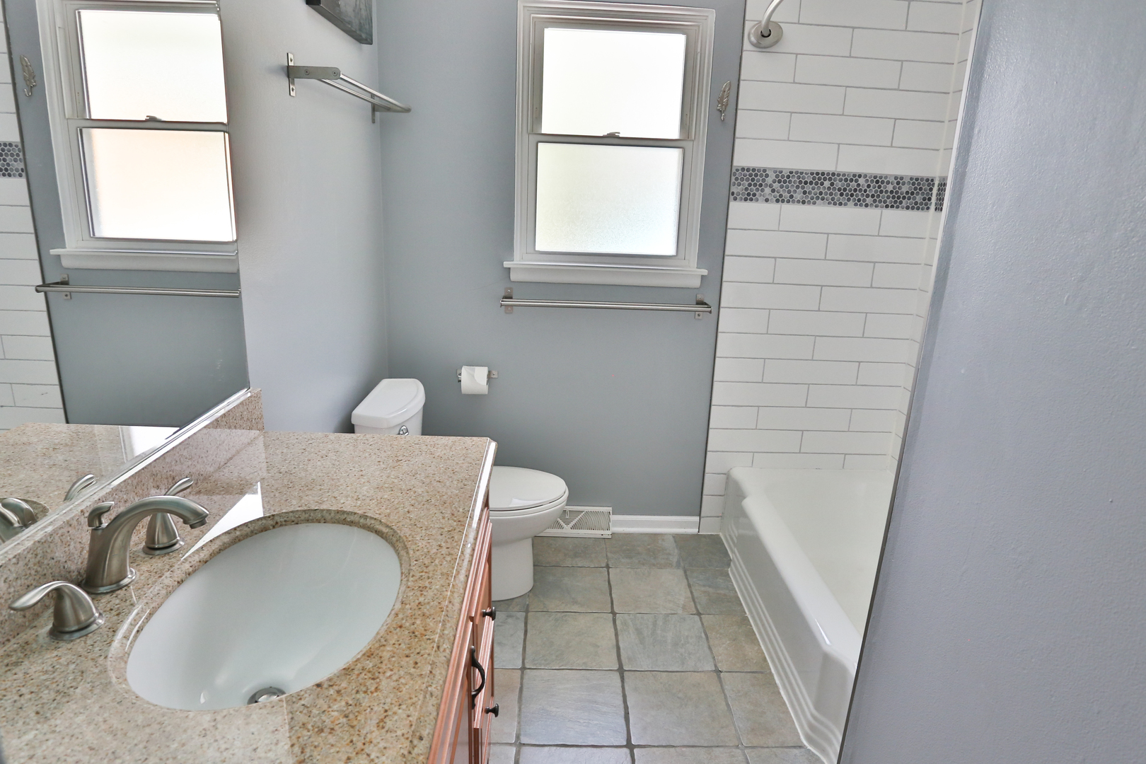413 West Gartner Road Naperville, IL 60540 - Photo 16 of 22 a bathroom with a granite countertop sink and a mirror