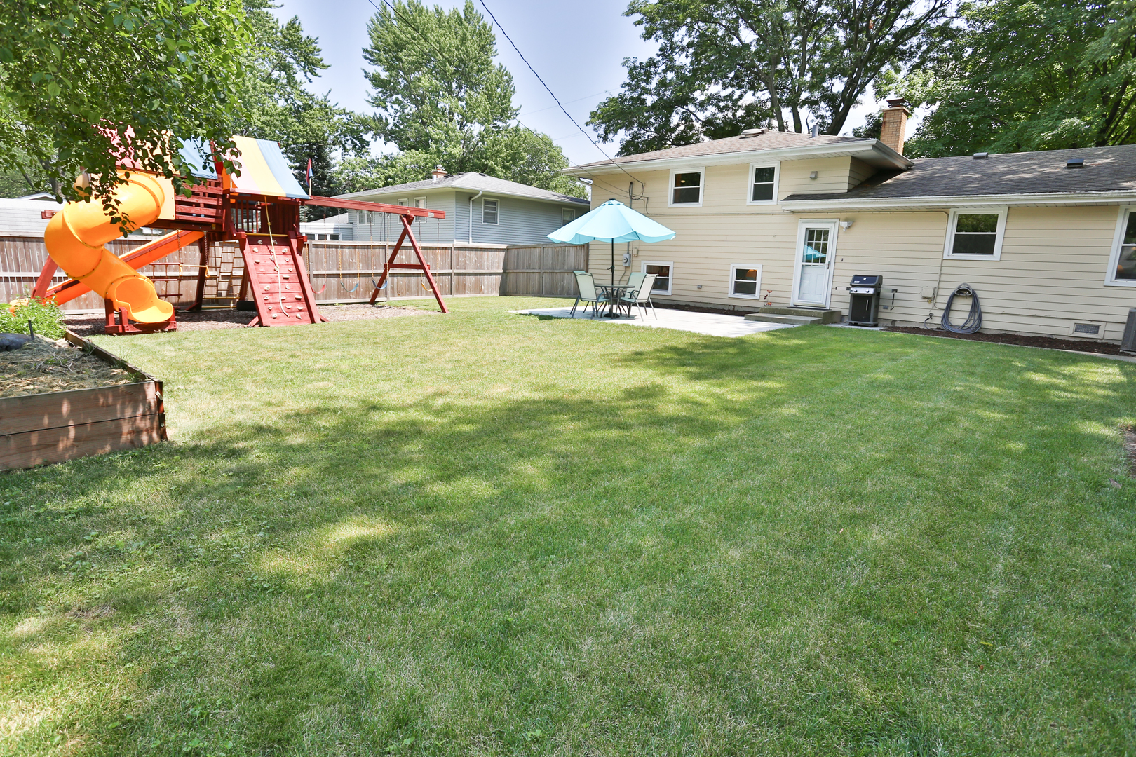 413 West Gartner Road Naperville, IL 60540 - Photo 19 of 22 a view of a house with backyard and sitting area