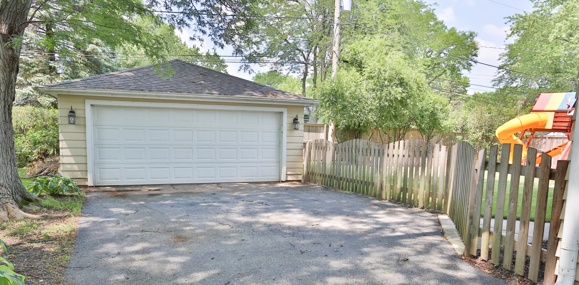 413 West Gartner Road Naperville, IL 60540 - Photo 22 of 22 a view of a house with a small yard and plants