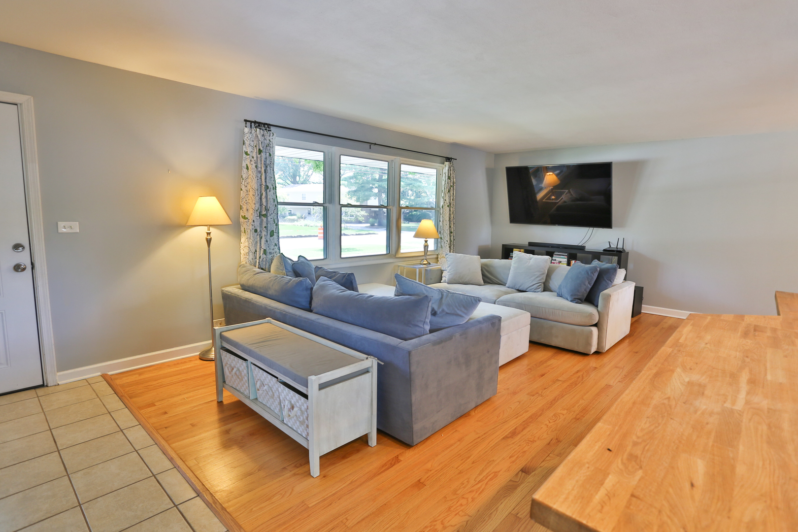 413 West Gartner Road Naperville, IL 60540 - Photo 5 of 22 a living room with furniture and a flat screen tv