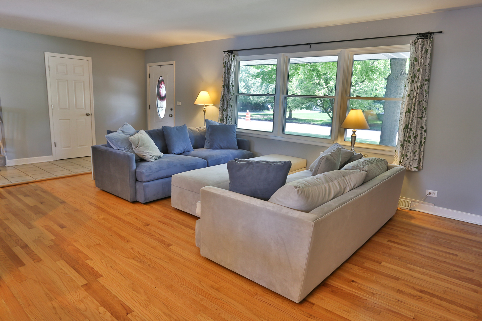 413 West Gartner Road Naperville, IL 60540 - Photo 6 of 22 a living room with furniture and a large window