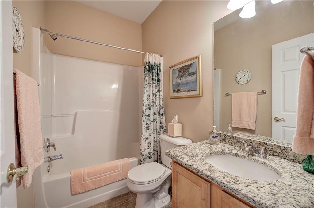 3383 Raes Creek Road, Unit 4 Marietta, GA 30008 - Photo 12 of 41 a bathroom with a granite countertop sink toilet and shower