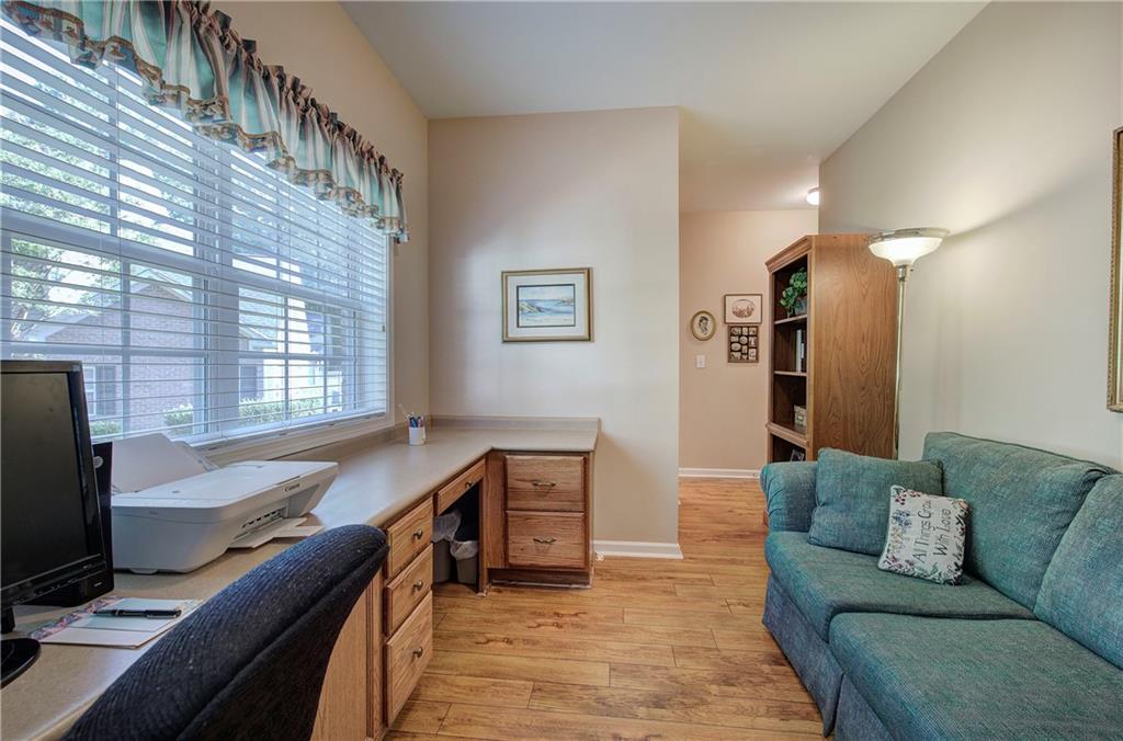 3383 Raes Creek Road, Unit 4 Marietta, GA 30008 - Photo 25 of 41 a living room with furniture and a flat screen tv