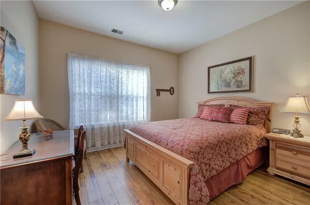 a bed room with a bed and a lamp