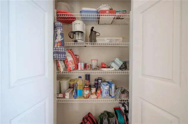 a view of storage and utility room with lots of clutter