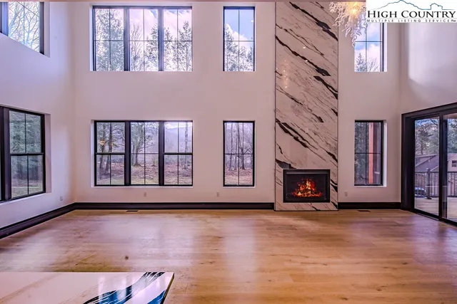 a room with a chair and a potted plant